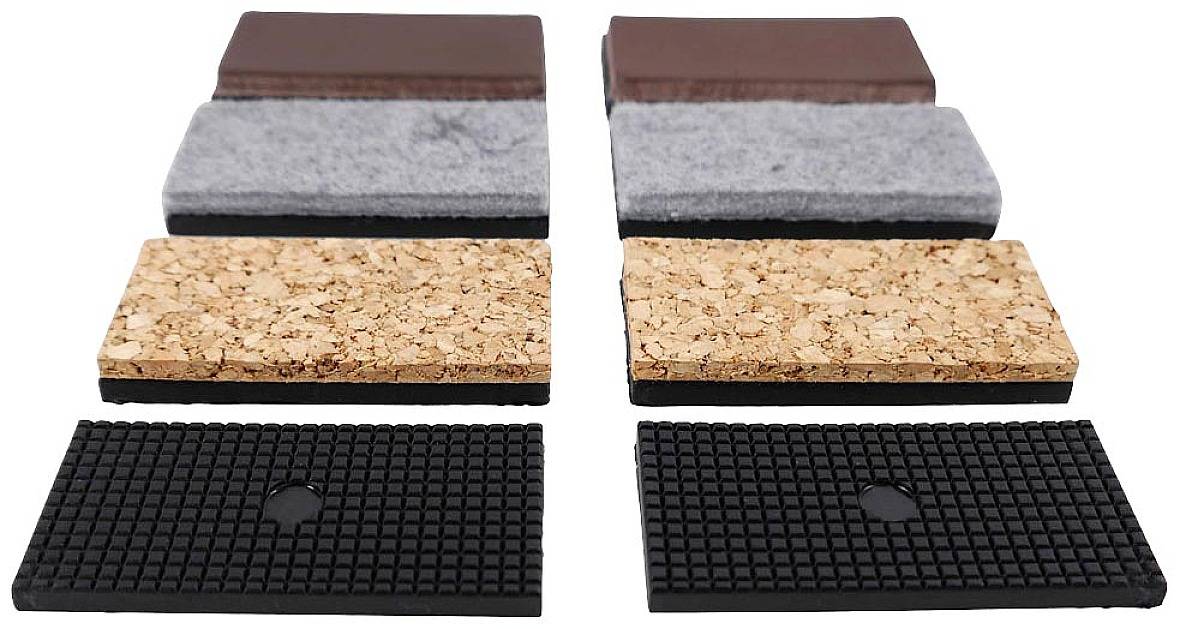 Sześć prostokątnych bloków wykonanych z różnych materiałów: drewna, filcu, korka i gumy. Są ułożone w dwóch rzędach.