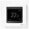 Cyfrowy termostat wyświetla temperaturę '22.0' stopni. Znajdują się na nim strzałki w górę i w dół do regulacji temperatury.