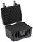 Czarny, otwarty pojemnik z tworzywa sztucznego z wyściółką piankową, odpowiedni do bezpiecznego transportu delikatnego sprzętu.