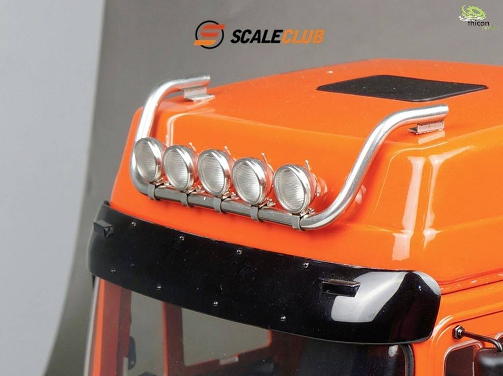 Model pomarańczowego dachu ciężarówki z pięcioma reflektorami i zakrzywionymi metalowymi prętami.