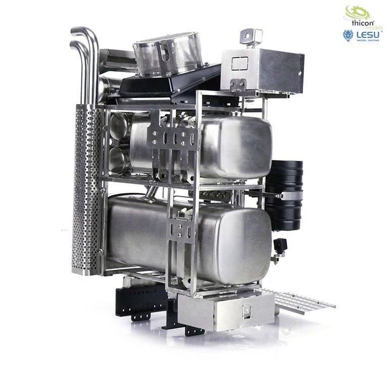 Złożona metalowa konstrukcja z wieloma cylindrami, komorą na dokumenty, rurami i czarnym filtrem. Etykieta 'thicon' w prawym górnym rogu.