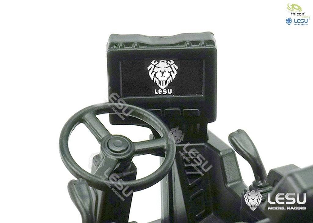 Modelowe kierownica i deska rozdzielcza z logo 'LESU' i emblematem lwa, prawdopodobnie część zabawkowego pojazdu.