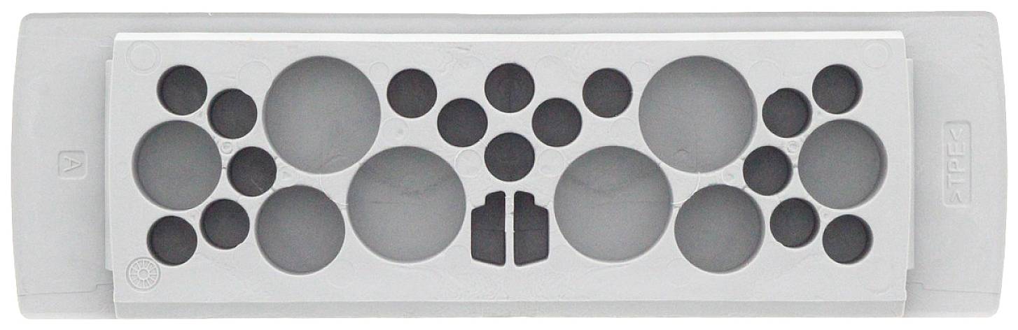 Szary pojemnik z tworzywa sztucznego z wzorem różnej wielkości okrągłych wgłębień pośrodku.