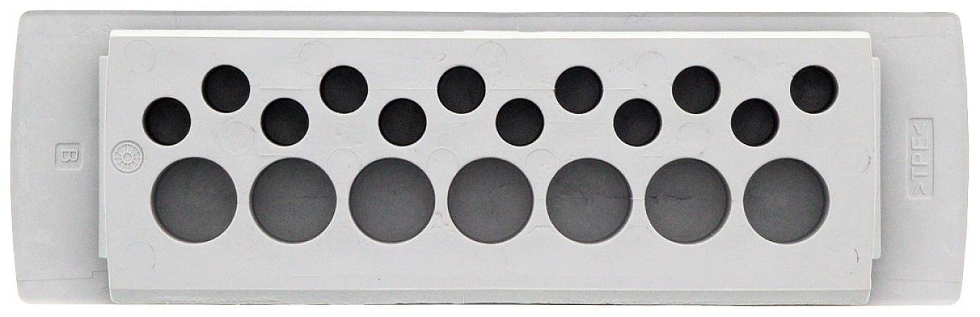 Szary element wykonany z tworzywa sztucznego z kilkoma otworami okrągłymi o różnych rozmiarach.