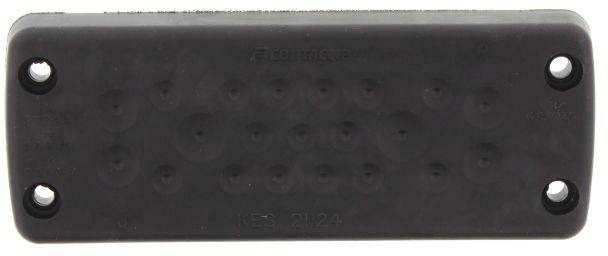 Prostokątna, czarna płyta z tworzywa sztucznego z czterema otworami w narożnikach. Struktura powierzchni z wypukłymi punktami.