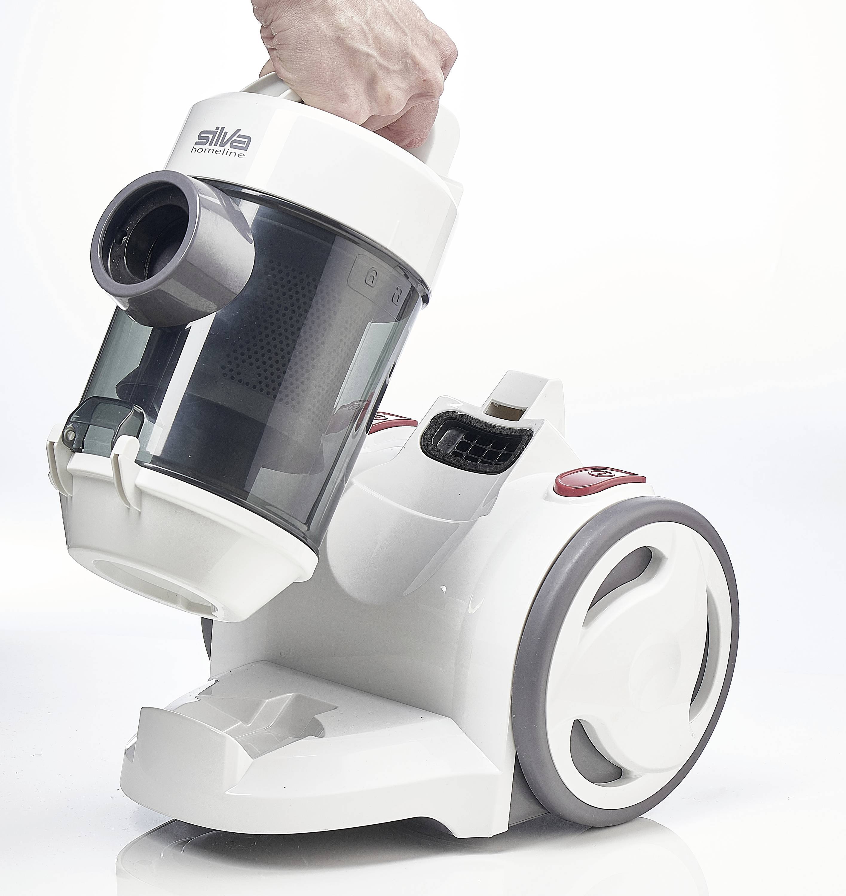 Dłoń trzyma białą odkurzacz z przezroczystym zbiornikiem na kurz. Odkurzacz posiada duże koła i nowoczesny design.