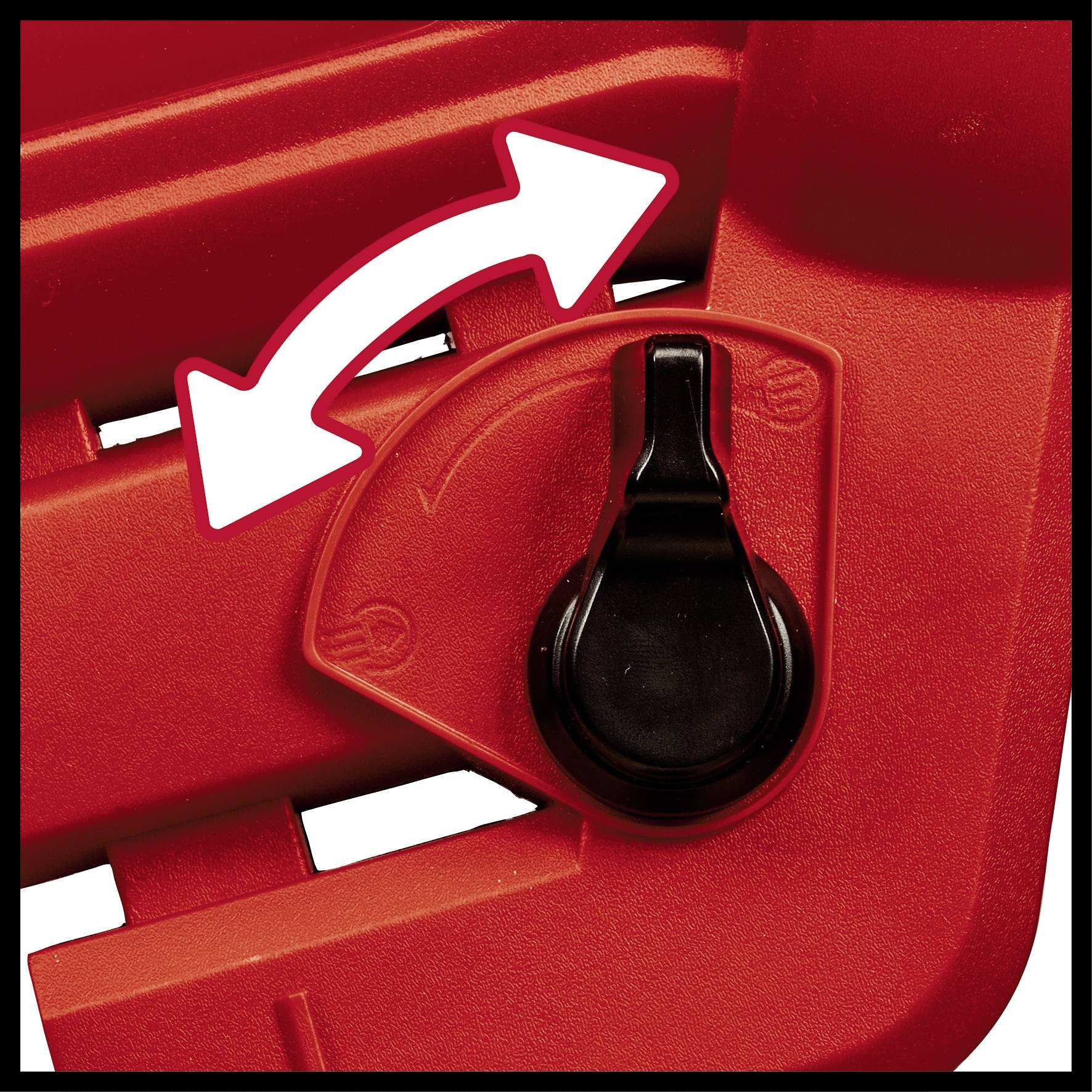 Czerwone urządzenie nastawcze z czarną dźwignią i białymi strzałkami wskazującymi kierunek.