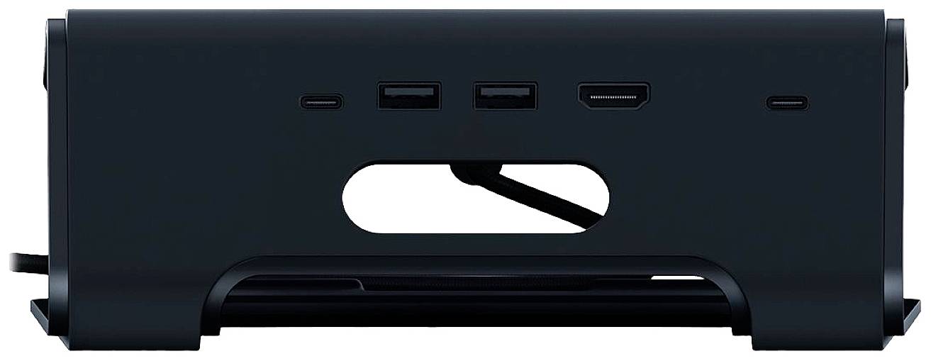 Czarny elektroniczny przyrząd z wieloma portami pośrodku, odpowiedni do podłączania różnych urządzeń elektronicznych.