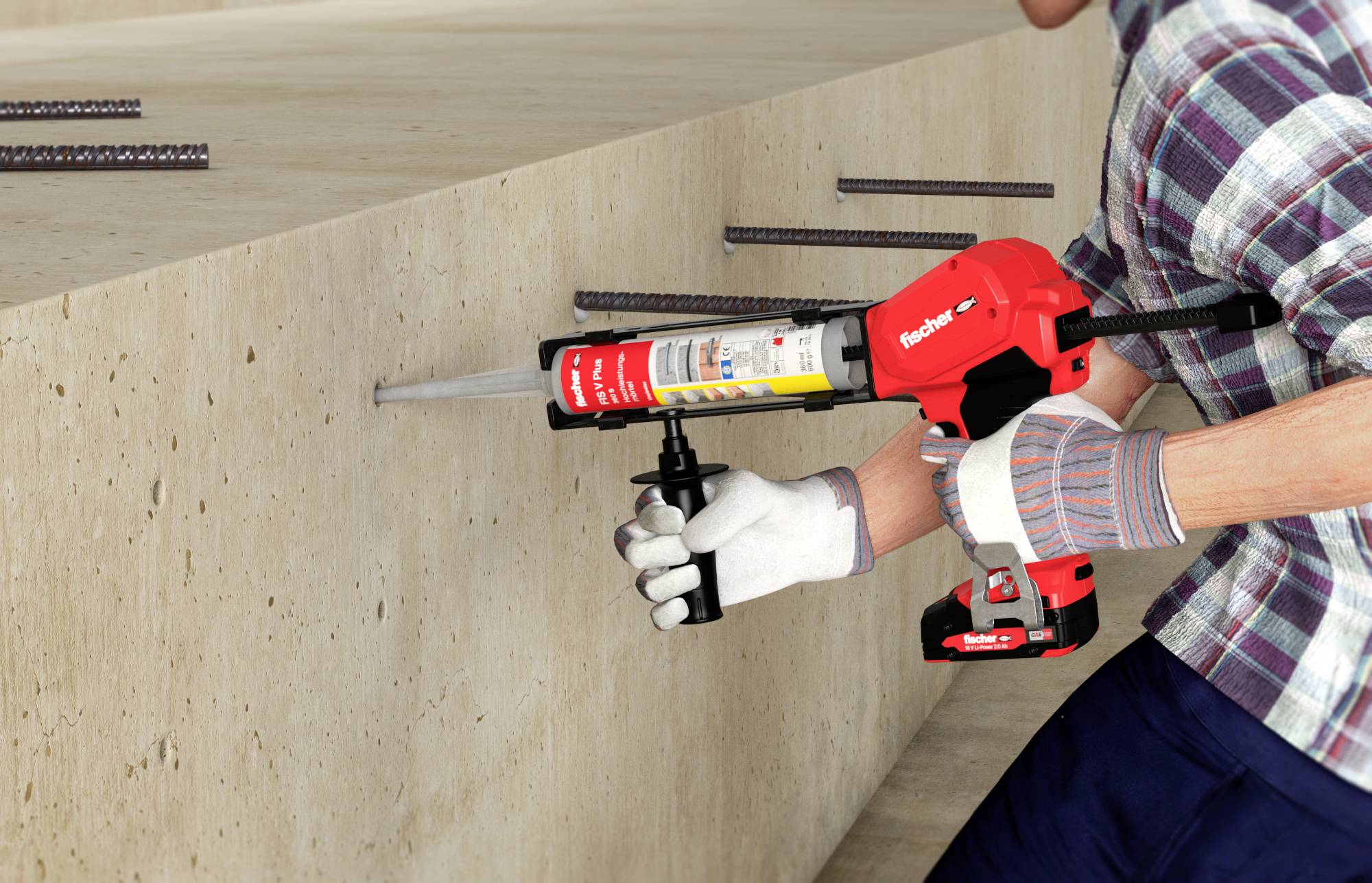 Osoba wtryskuje klej z czerwonego pistoletu do kartusza w otworze ścianki betonowej, aby zamocować stalowy kołek.