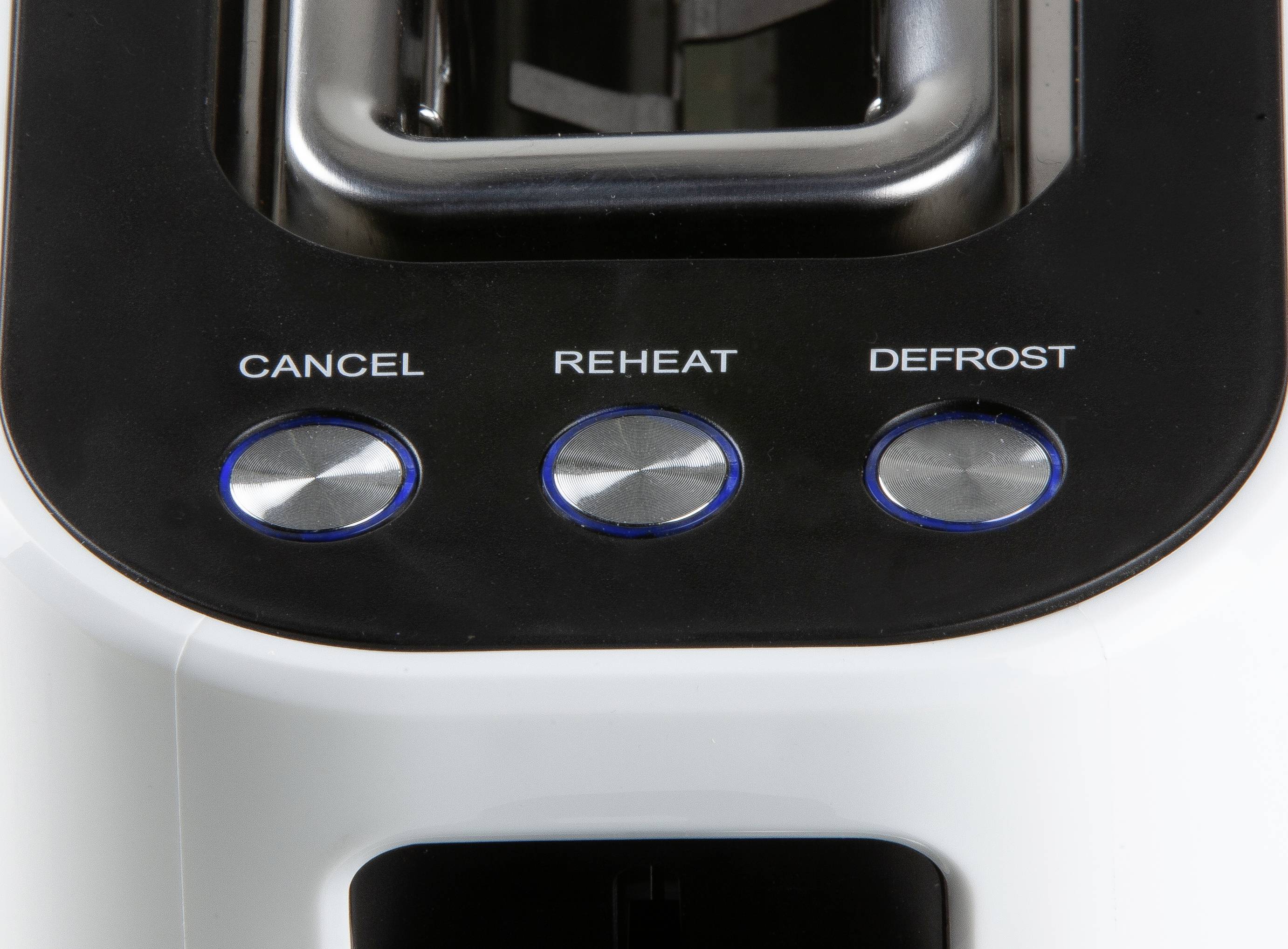 Zbliżenie tostera z trzema przyciskami: 'Anuluj', 'Podgrzej', 'Rozmroź'. Na górze widoczne są szczeliny na tosty.