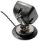 Mała, czarna kamera z kablem na okrągłej podstawie, prawdopodobnie do monitoringu.