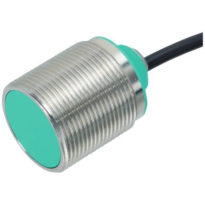 Cylindryczny czujnik z przyłączem kablowym, obudowa metalowa, zielony kapturek. Element elektroniczny do pomiaru odległości.