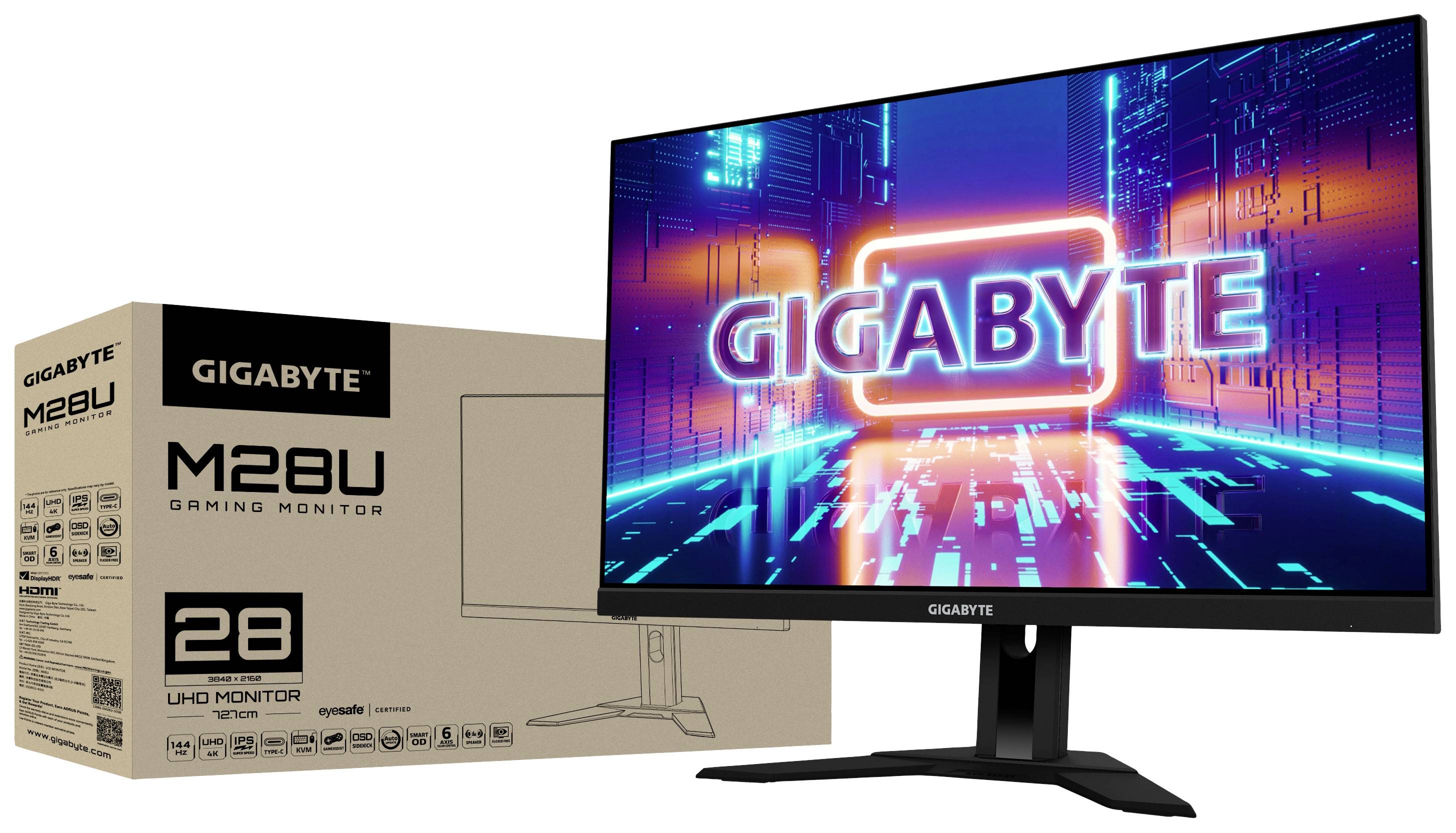 Monitor gamingowy o przekątnej 28 cali firmy Gigabyte umieszczony obok opakowania, z wyświetlaczem 'GIGABYTE' na futurystycznym tle.