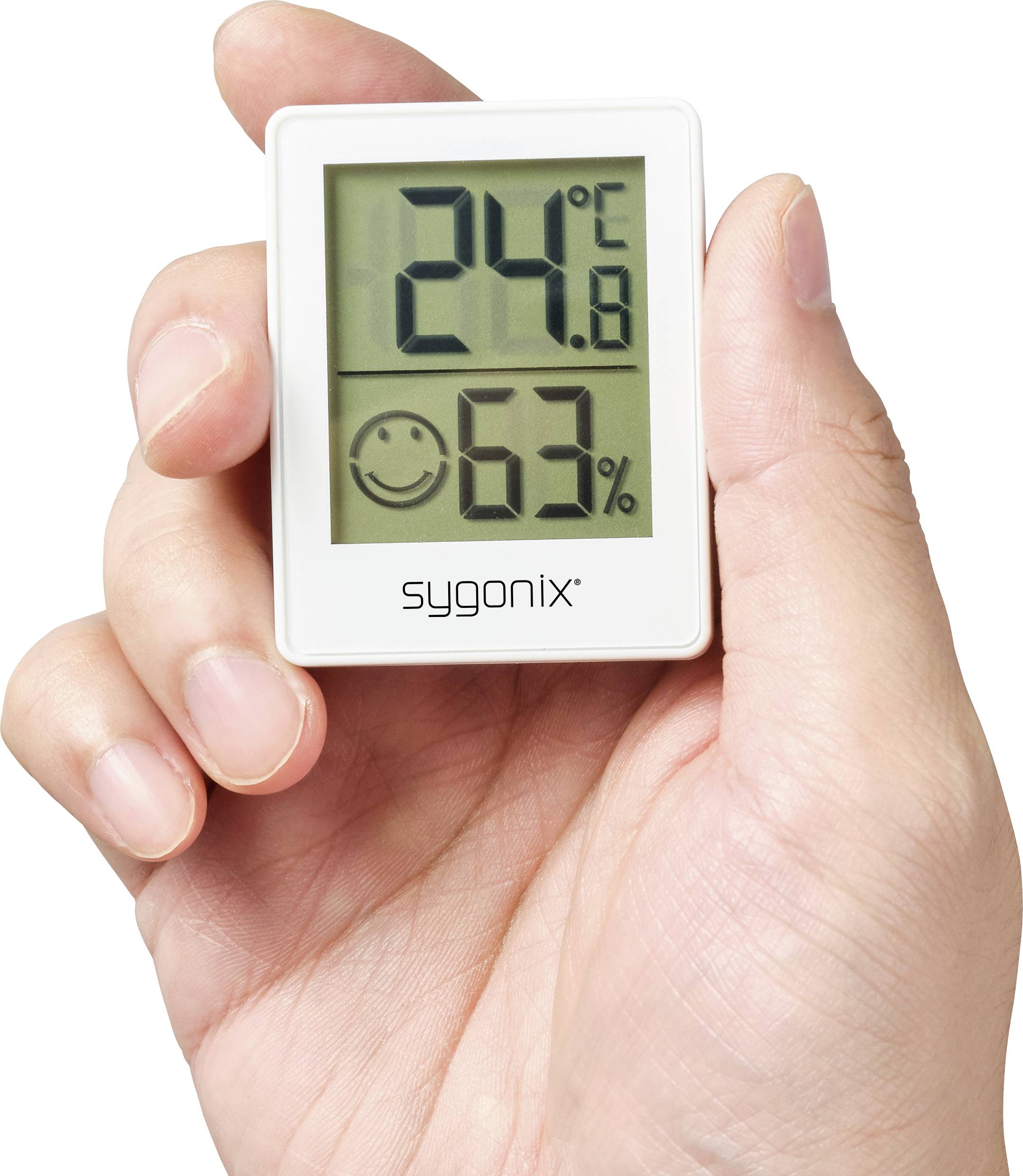 Dłoń trzyma cyfrowy termometr, który wskazuje 24,8 stopni Celsjusza i 63% wilgotności, z uśmiechniętą ikoną twarzy.