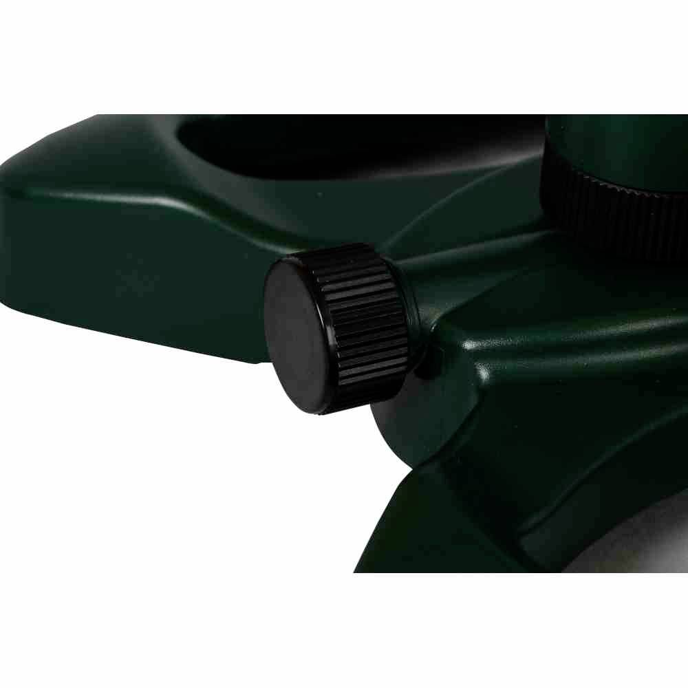 Zielony sprzęt z czarnym pokrętłem, prawdopodobnie będący częścią urządzenia ogrodowego lub uchwytu.
