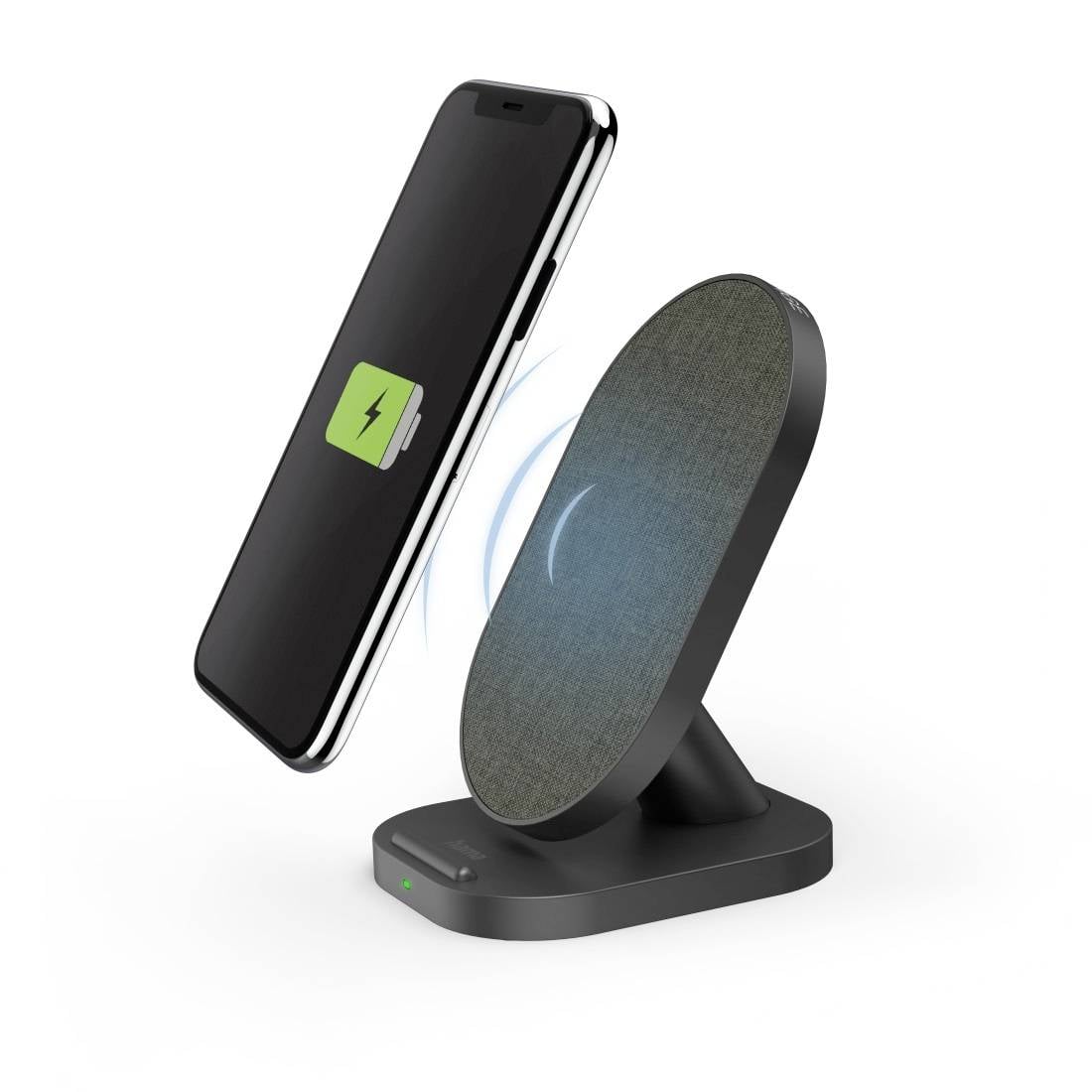 Smartfon jest ładowany bezprzewodowo na stacji ładującej z zielonym symbolem wskazującym postęp ładowania.