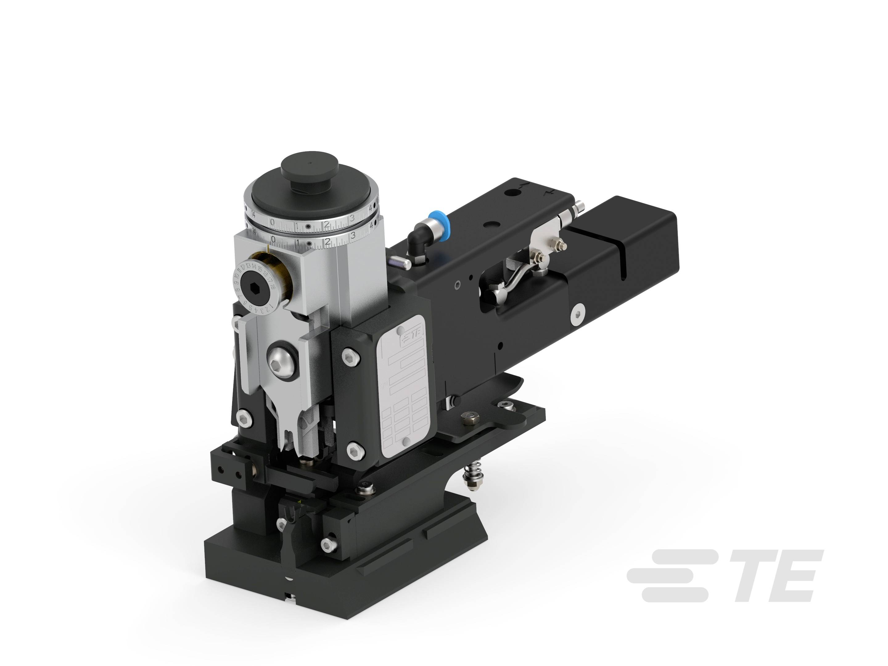 Czarny, techniczny sprzęt z srebrnymi akcentami, prawdopodobnie element maszyny. Na białym tle z logo TE.
