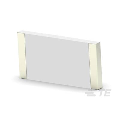 Kondensator ceramiczny, prostokątny, z metalowymi końcówkami.