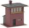 Mały czerwony domek modelowy z czarnym dachem i kominem. Ma duże okna na górnym piętrze i drzwi na dole.