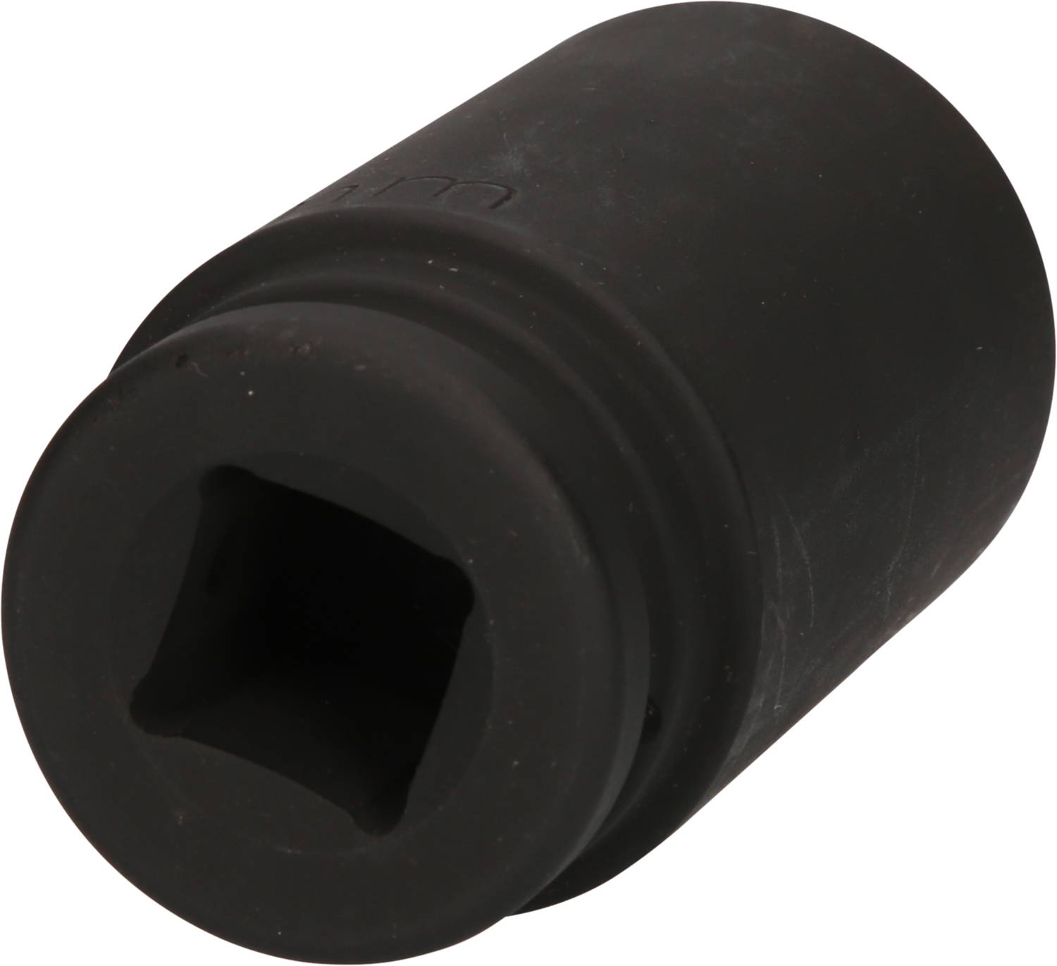 Czarny cylindryczny element gumowy z kwadratowym otworem i żebrowaną stroną. Może być elementem tłumiącym.