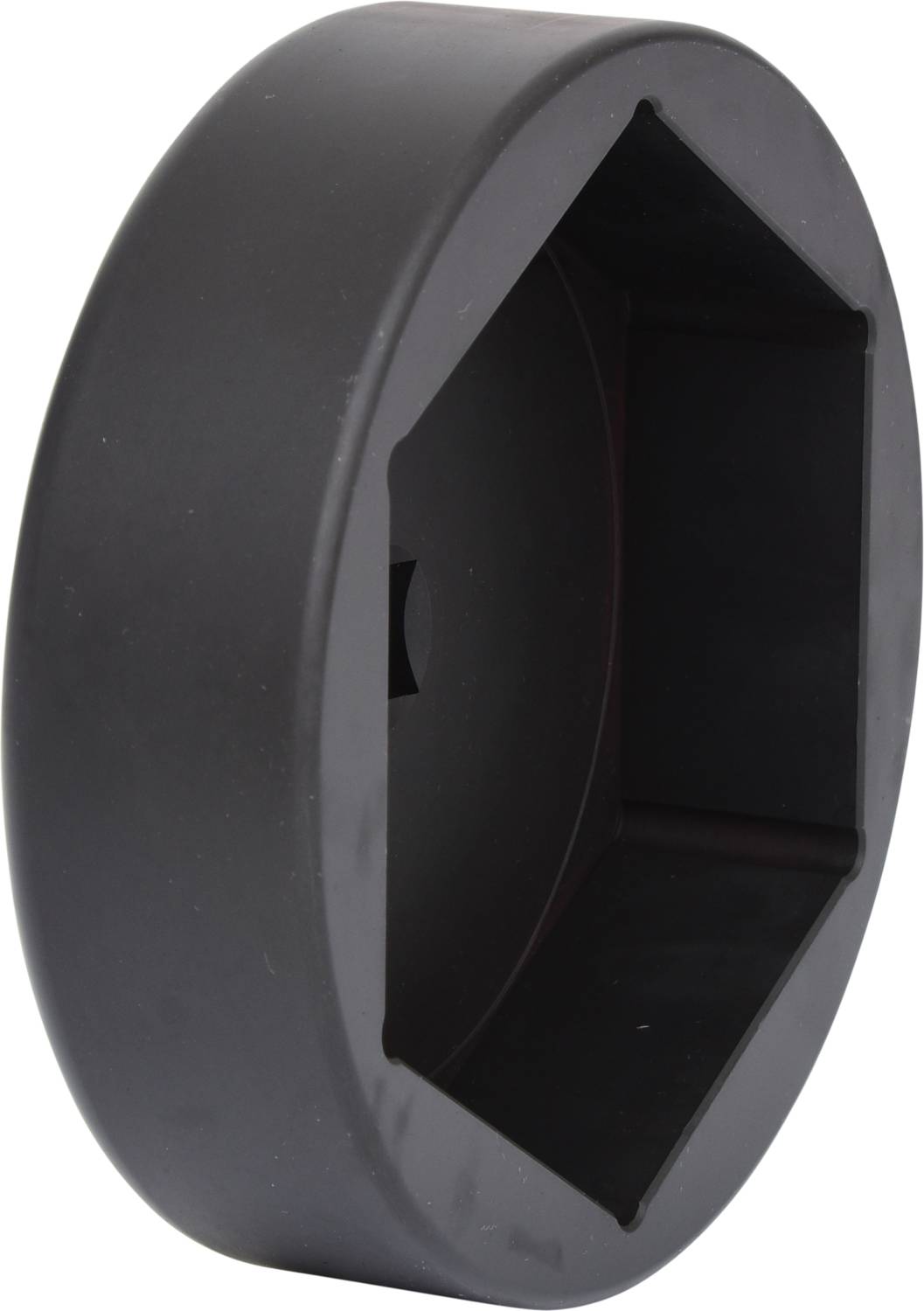 Czarny, sześciokątny obiekt o gładkiej powierzchni, prawdopodobnie narzędzie lub pokrywa.