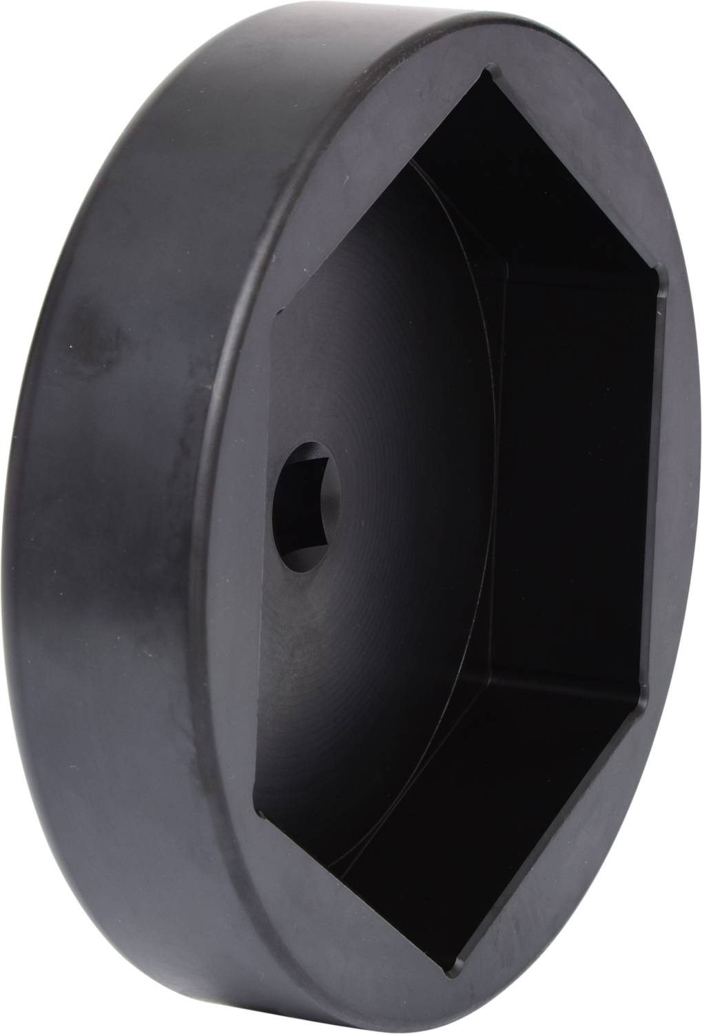 Okrągła, czarna plastikowa pokrywka z sześciokątnym zagłębieniem pośrodku, prawdopodobnie element narzędzia lub maszyny.