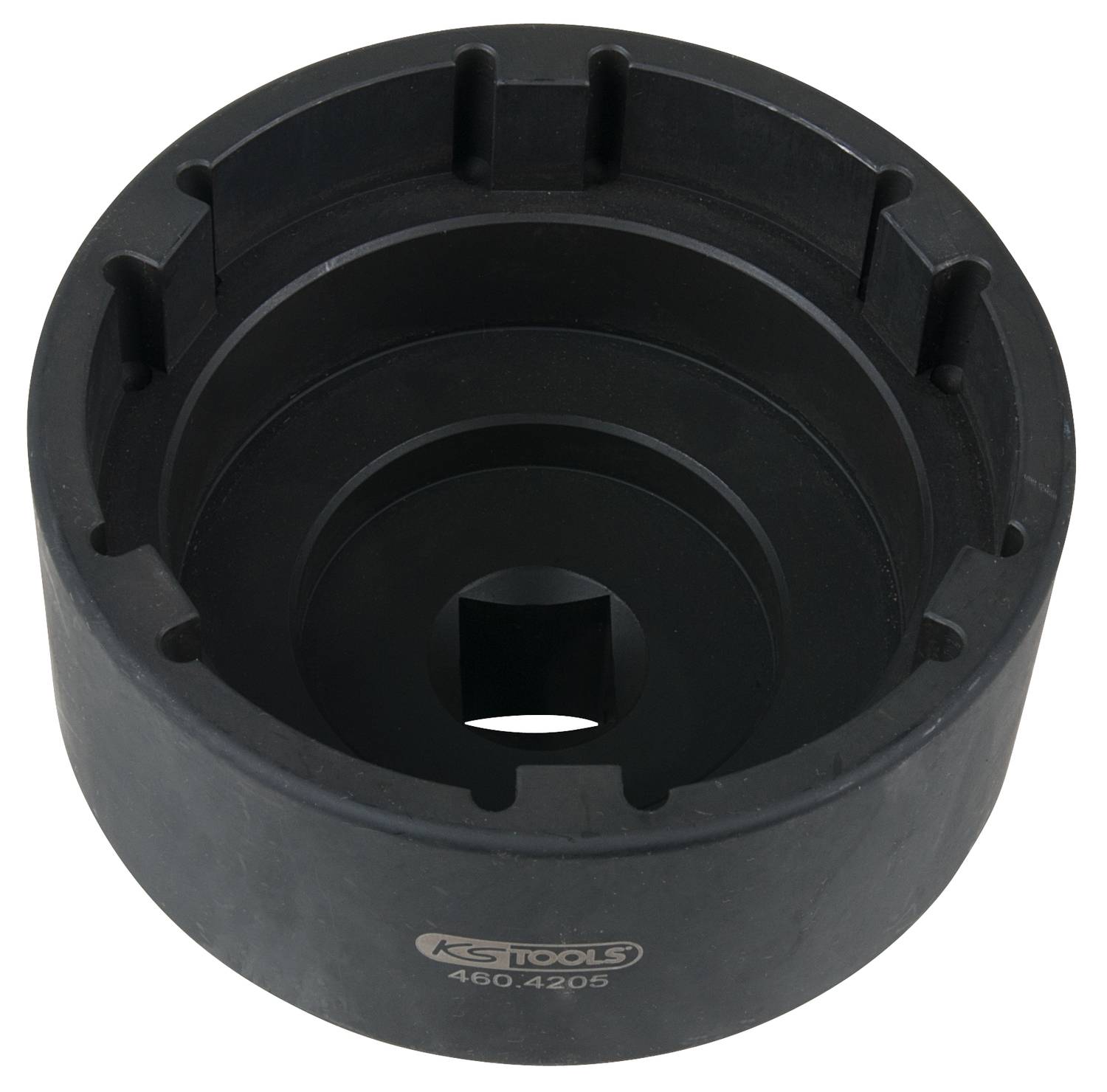 Czarne, cylindryczne narzędzie z wieloma nacięciami i kwadratowym otworem pośrodku.