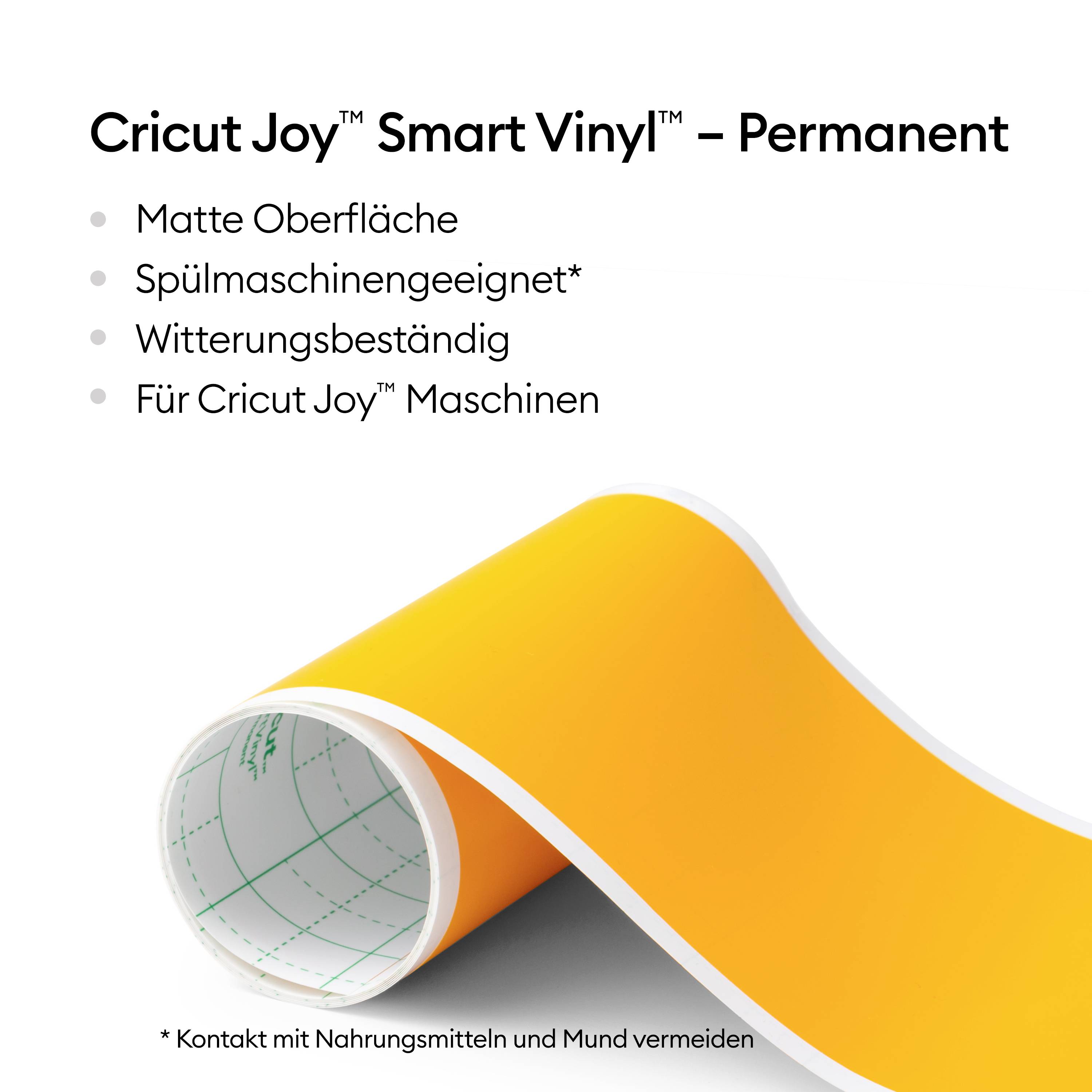 Rysunek przedstawia rolkę żółtego winylu z napisem 'Cricut Joy Smart Vinyl – Permanent'. Cechy: matowa powierzchnia, nadaje się do zmywarki, odporny na warunki atmosferyczne, przeznaczony do maszyn Cricut Joy.