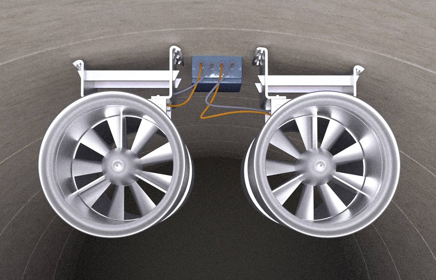 Dwa duże wentylatory są zamontowane na suficie tunelu, połączone przewodami elektrycznymi prowadzącymi do niebieskiej skrzynki sterującej.