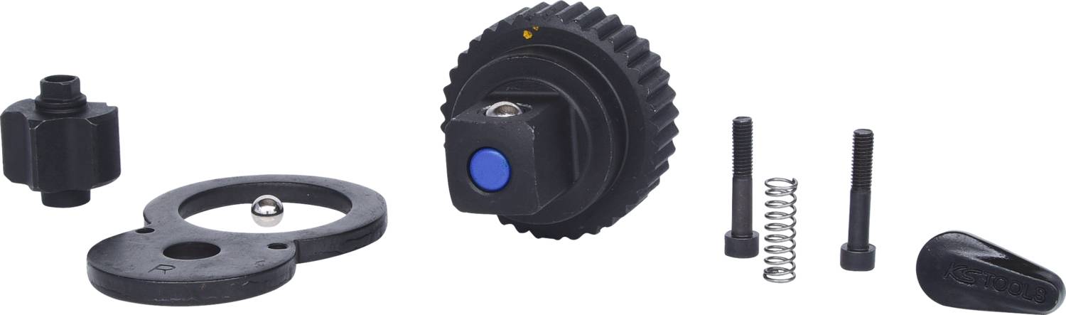 Zestaw akcesoriów do aparatu: koło zębate, śruby, sprężyna i inne części, które prawdopodobnie są używane do montażu lub regulacji.