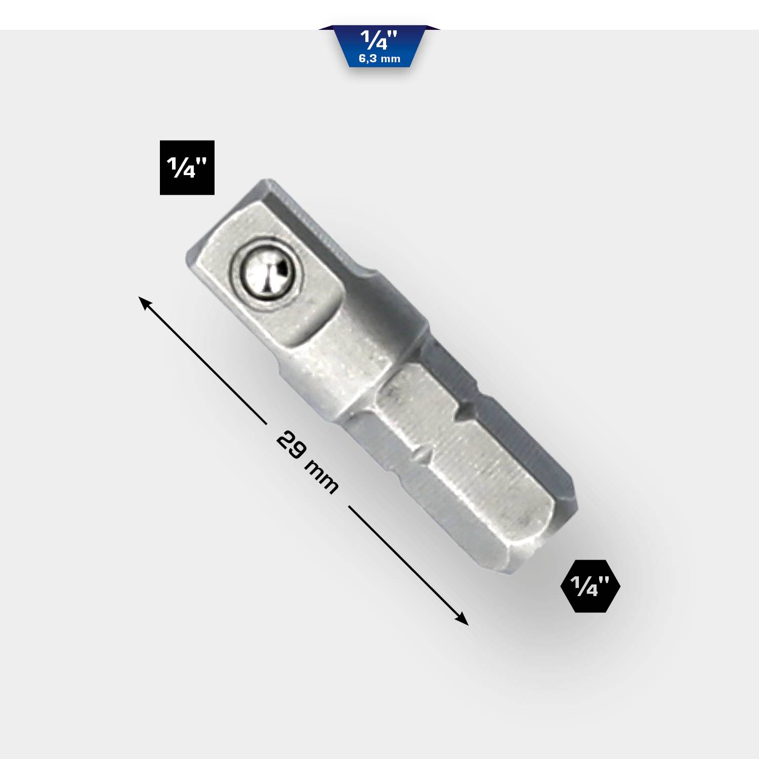 Srebrny adapter z nakładką 1/4 cala o długości 29 mm. Oznaczenia wskazują wymiary. Odpowiedni do narzędzi.