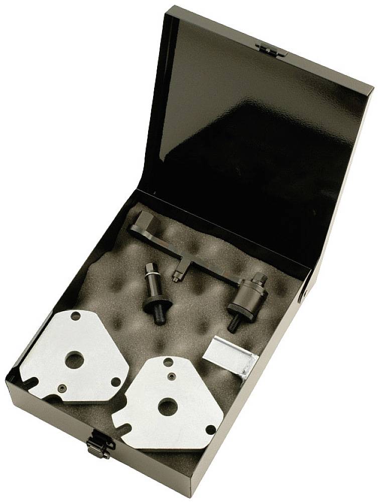 Otwarty przybornik z różnymi elementami metalowymi i osprzętem, ułożonymi w wyściełanych wkładkach piankowych. Idealny do konserwacji maszyn.