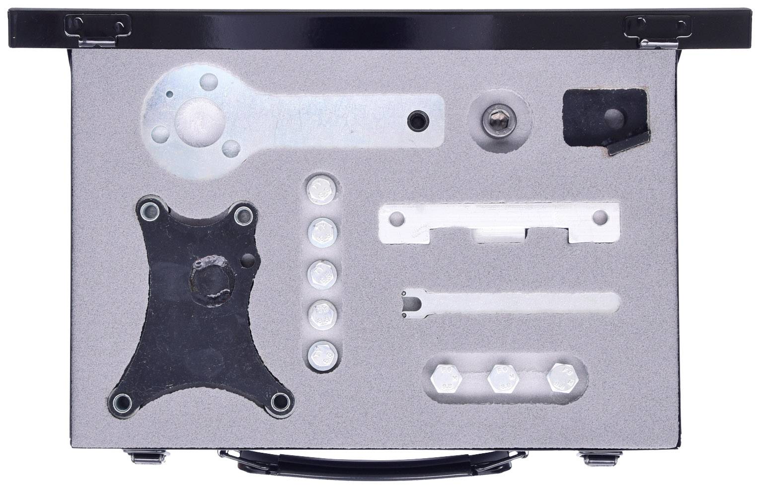 Metalowa płyta z różnymi elementami mechanicznymi i śrubami, umieszczonymi w prostokątnej obudowie.