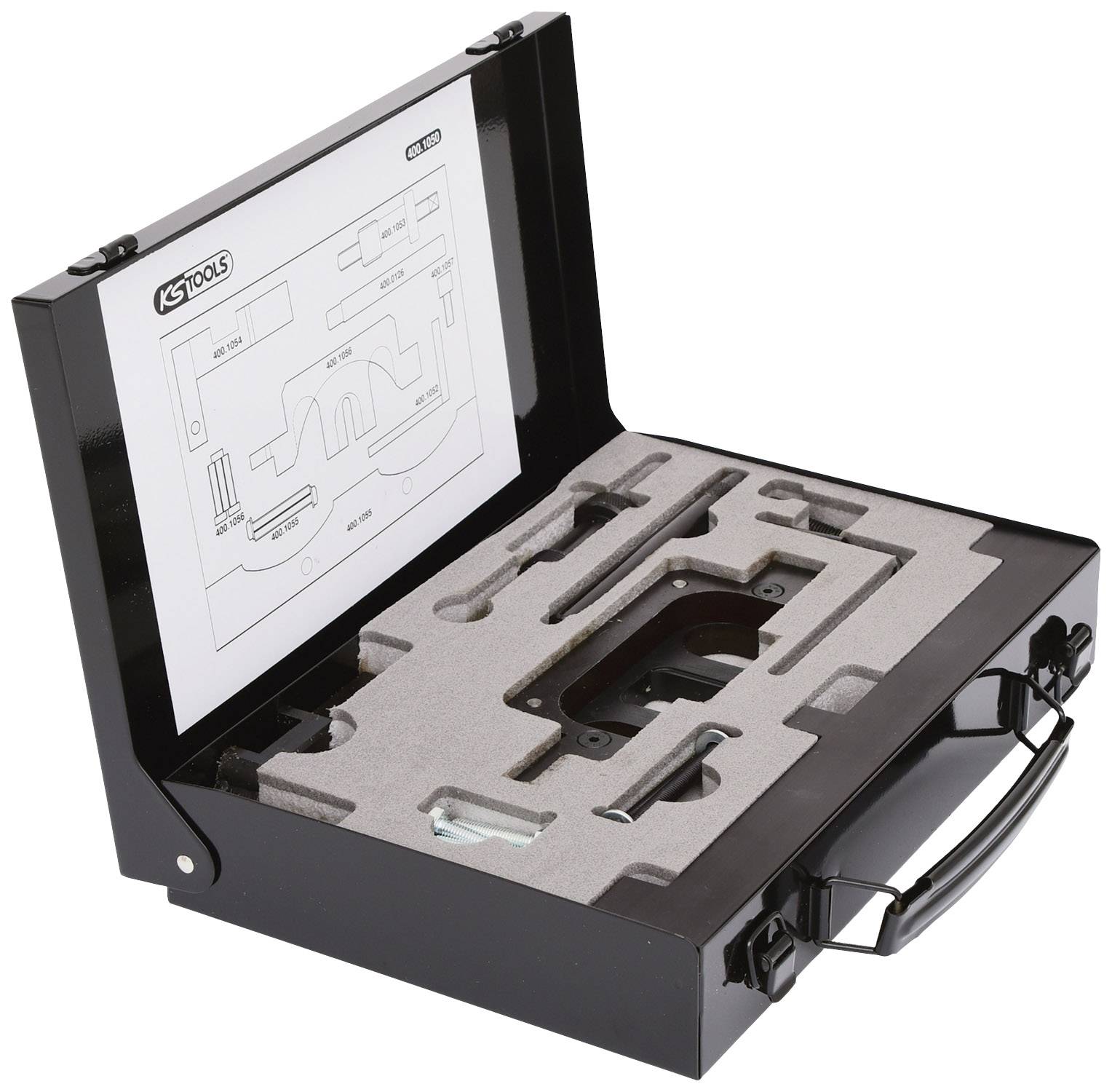 Otwarty kufer narzędziowy z wyściółką piankową i różnymi narzędziami. Kartka z instrukcją montażu leży w pokrywie.