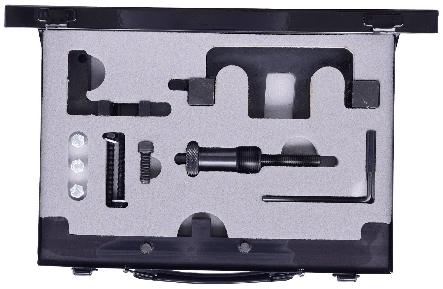 W czarnej walizce różne narzędzia metalowe są starannie ułożone w piankowych wkładkach, gotowe do użycia.