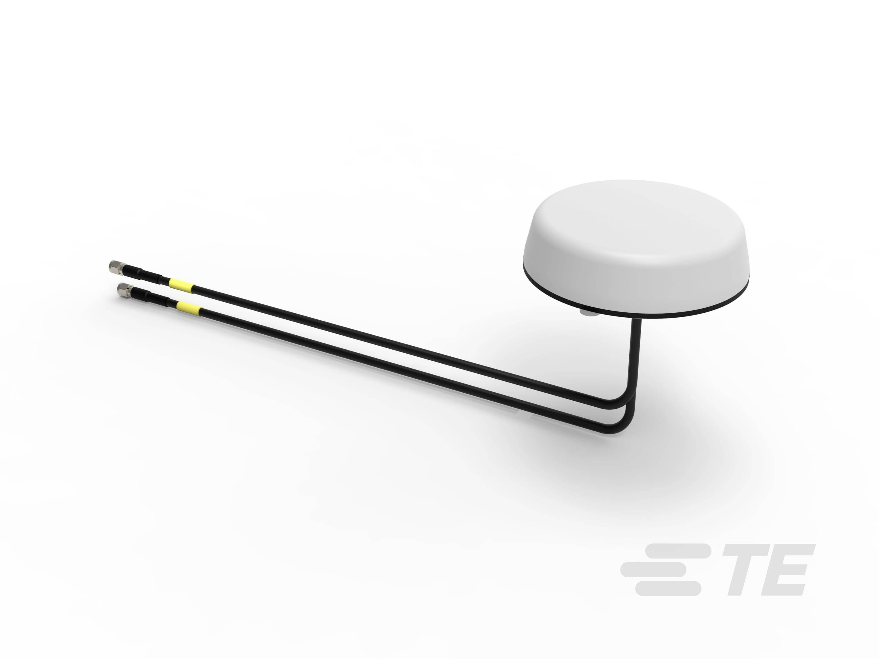 Płaski, okrągły element antenowy z dwoma wychodzącymi czarnymi kablami, na jasnym tle.