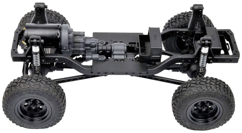 Podwozie terenówki z dużymi oponami do jazdy w terenie, zawieszeniem i widoczną techniką napędową. Odpowiednie do budowy pojazdu lub modelu.
