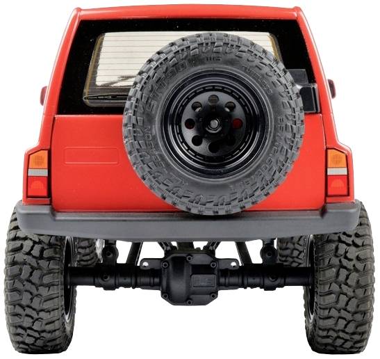 Czerwony pojazd terenowy widziany od tyłu, z kołem zapasowym przymocowanym do tylnej klapy, z dużymi oponami i podwyższonym zawieszeniem.