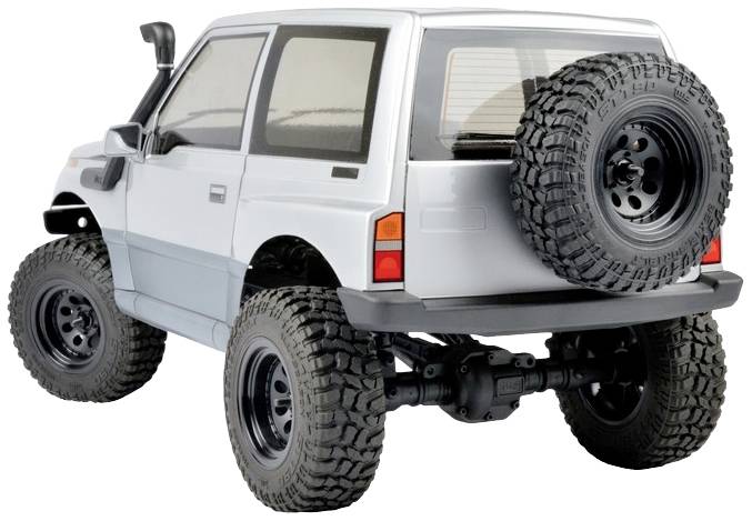 Zabawkowy samochód terenowy w srebrnym kolorze z dużym kołem zapasowym z tyłu, solidnymi oponami i podwyższonym zawieszeniem, z lusterkami bocznymi.