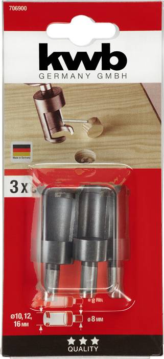 Opakowanie z trzema piłami otworowymi do wiertarek do drewna, rozmiary 10 mm, 12 mm, 16 mm. Prezentuje przykładowe zastosowanie na desce drewnianej. Marka: kwb.