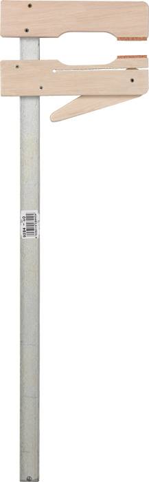 Ścisk stolarski z długą metalową rączką i drewnianym mechanizmem zaciskowym, ustawiony bocznie. Używany do mocowania elementów obrabianych.