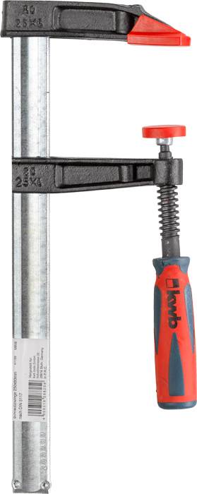 Ścisk śrubowy z czerwonym uchwytem i szczękami zaciskowymi. Używany do pewnego mocowania materiałów podczas prac warsztatowych.