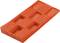 Prostokątny, czerwony plastikowy klin z wielopoziomowymi nacięciami. Często stosowany w budownictwie do podparcia i wyrównywania elementów.