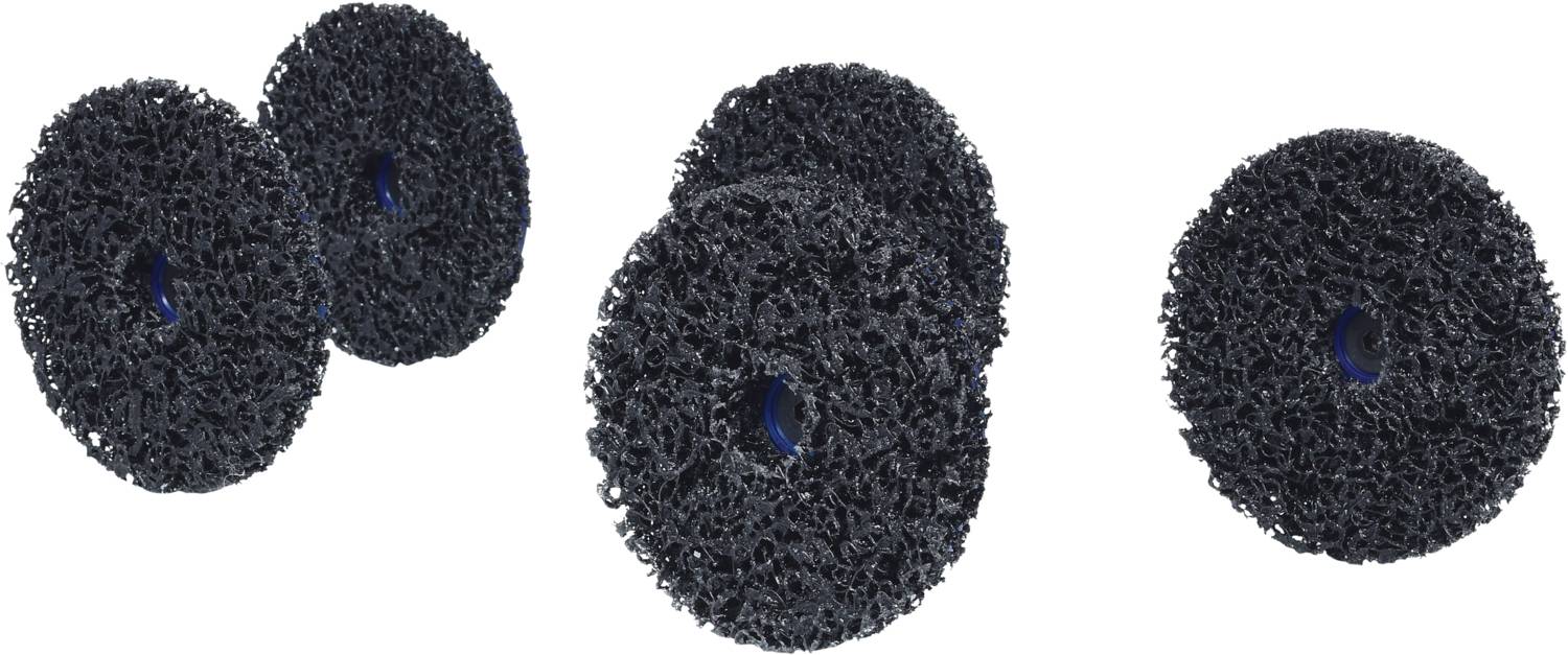 Kilka czarnych padów ściernych o chropowatej strukturze, rozmieszczonych równomiernie.