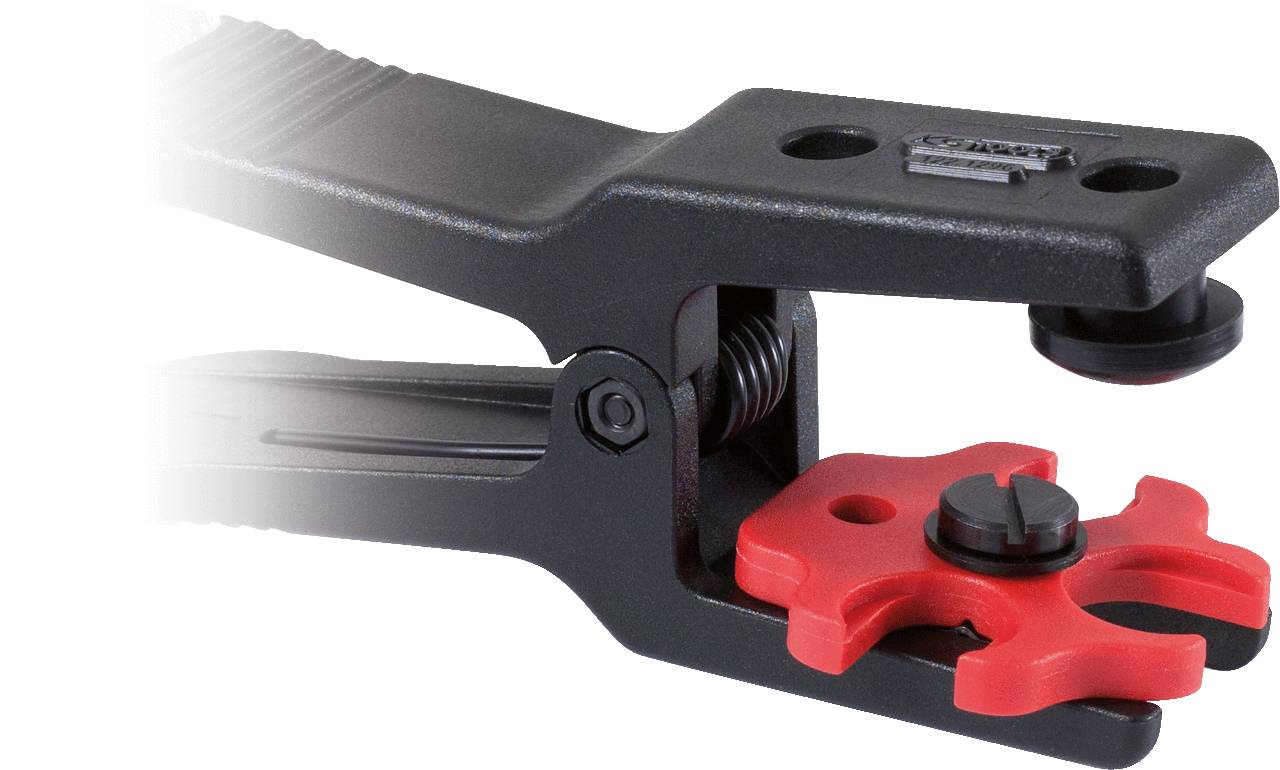 Narzędzie z czarną rękojeścią i czerwonym końcem, używane do cięcia lub zaciskania kabli.