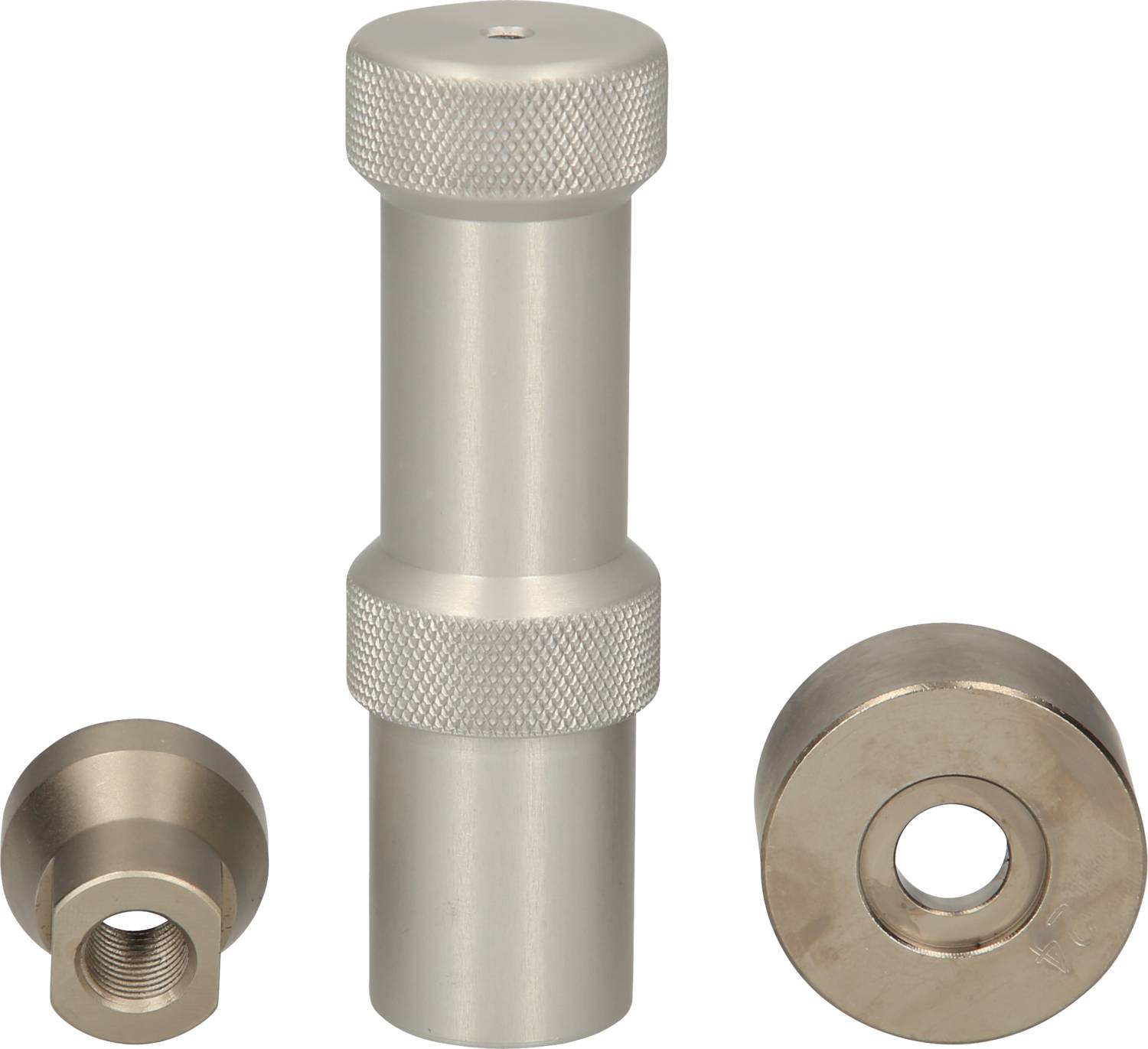 Metalowe cylindry i okrągłe komponenty na białym tle. Cylinder ma żebrowaną powierzchnię dla lepszego chwytu.