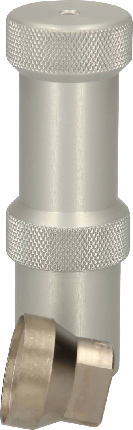 Metalowy cylinder o żebrowanej powierzchni i pochyłej, zdejmowanej nakładce od dołu, prawdopodobnie element techniczny.