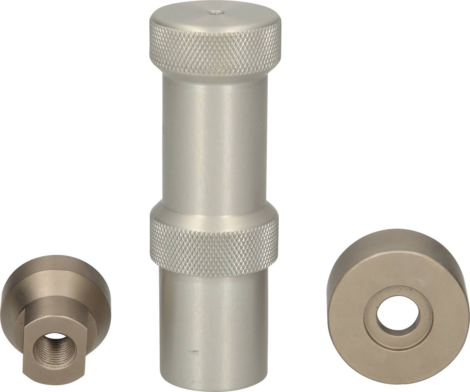 Narzędzia metalowe: Centralny, wydłużony adapter metalowy z prążkowaną rękojeścią, flanowany przez dwie cylindryczne części, po prawej i lewej stronie.