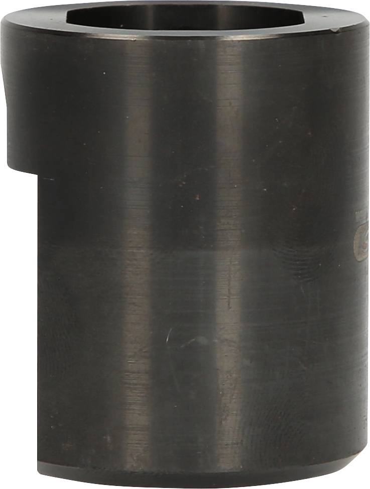 Cylindryczny metalowy element, prawdopodobnie specjalny klucz lub nasadka narzędziowa, wykonany z czarnego materiału, z sześciokątnym otworem na górze.