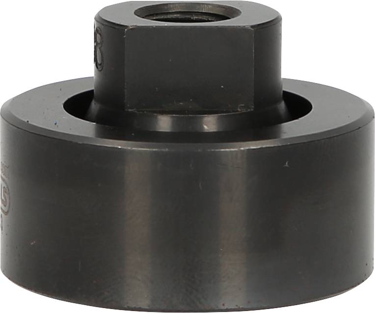 Czarny metalowy cylinder z sześciokątnym elementem na środku, prawdopodobnie część narzędzia lub maszyny.